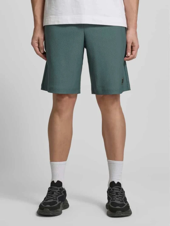 Zdjęcie produktu Szorty o kroju regular fit ze strukturalnym wzorem EA7 Emporio Armani Zielony