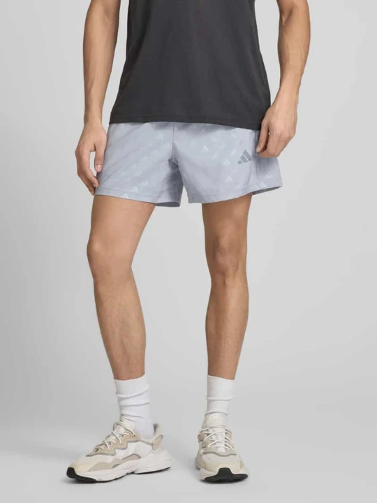 Zdjęcie produktu Szorty o kroju regular fit z wzorem z logo na całej powierzchni model 'WE BRLO SHO' Adidas Średnioszary