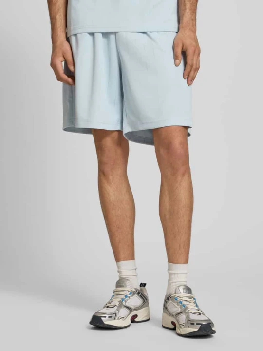 Zdjęcie produktu Szorty o kroju relaxed fit z elastycznym pasem model 'Insignia' Karl Kani Jasnoniebieski