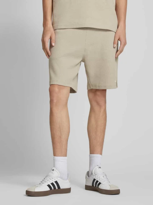 Zdjęcie produktu Szorty o kroju relaxed fit z fakturowanym wzorem Another Cotton Lab Złamany biały