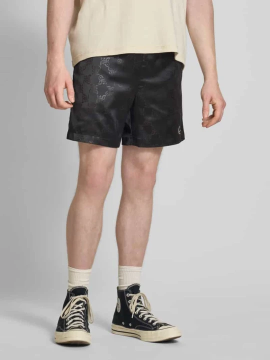 Zdjęcie produktu Szorty o kroju relaxed fit z nadrukiem z logo na całej powierzchni model ‘Signature’ Karl Kani Czarny