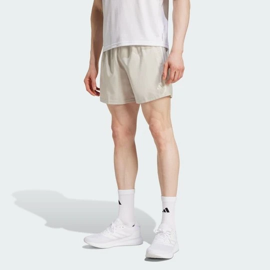 Zdjęcie produktu Szorty Own The Run Adidas beżowy