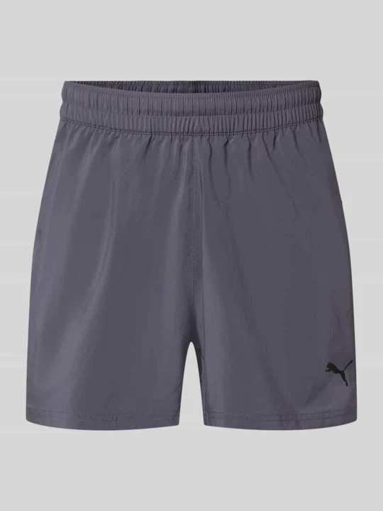 Zdjęcie produktu Szorty sportowe o kroju regular fit z nadrukiem z logo model „TAD ESSENTIALS” Puma Grafitowy