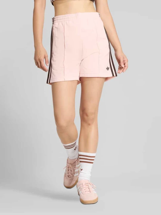 Zdjęcie produktu Szorty treningowe krój relaxed fit model 'FIREBIRD CLASSIC' adidas Originals Brudnoróżowy