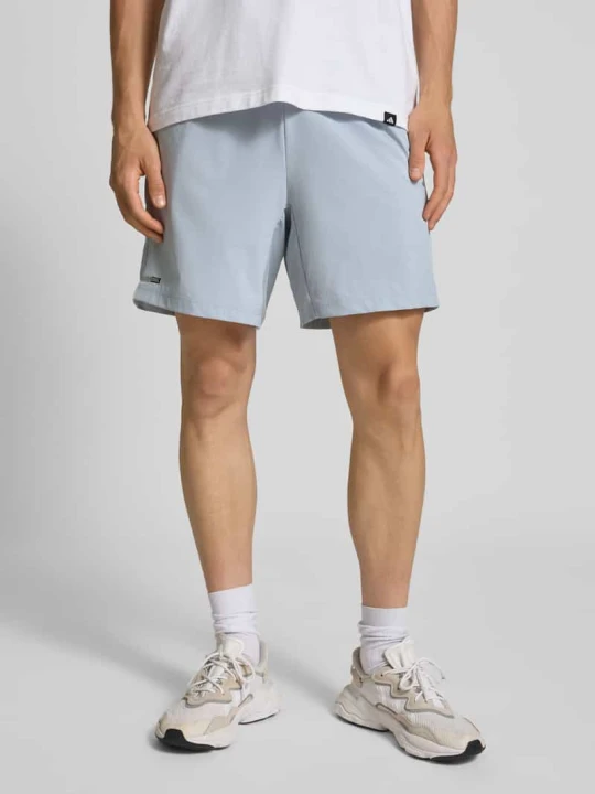Zdjęcie produktu Szorty z dzianiny dresowej o kroju regular fit z elastycznym pasem model ‘Halsil’ Adidas Jasnoszary