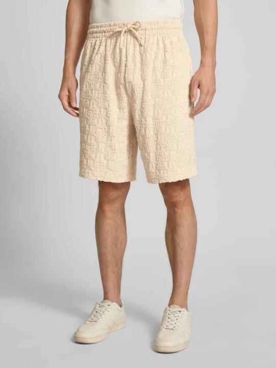 Zdjęcie produktu Szorty z dzianiny dresowej o kroju relaxed fit z froty model ‘Terry’ Karl Kani Beżowy