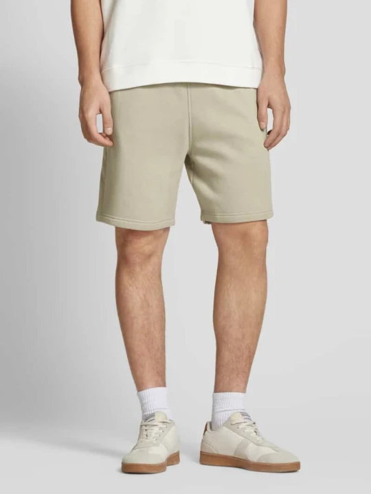 Zdjęcie produktu Szorty z dzianiny dresowej o kroju relaxed fit z mieszanki bawełny w stylu jogger Tom Tailor Beżowy