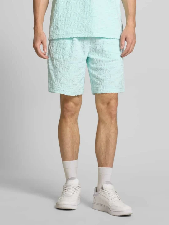 Zdjęcie produktu Szorty z elastycznym pasem i tunelem model ‘Terry’ Karl Kani Oceaniczny