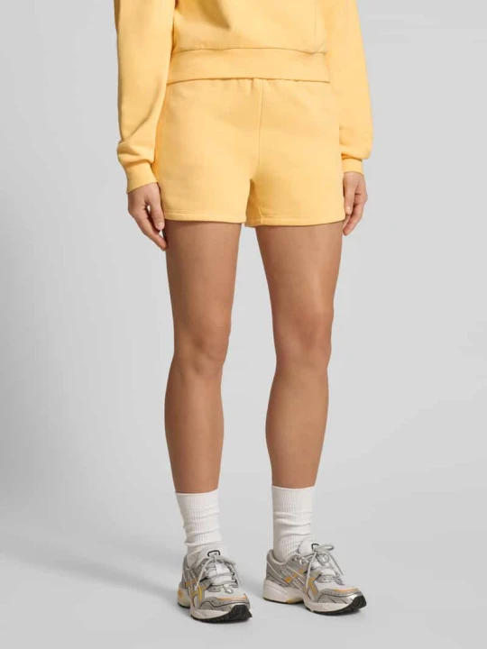 Zdjęcie produktu Szorty dresowe z logo i elastycznym pasem Adidas Ciemnożółty