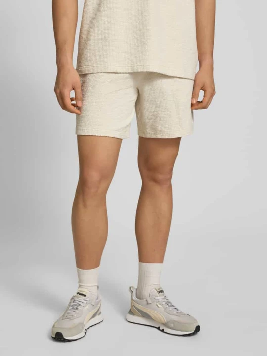Zdjęcie produktu Szorty z przeszyciem z logo Puma Złamany biały