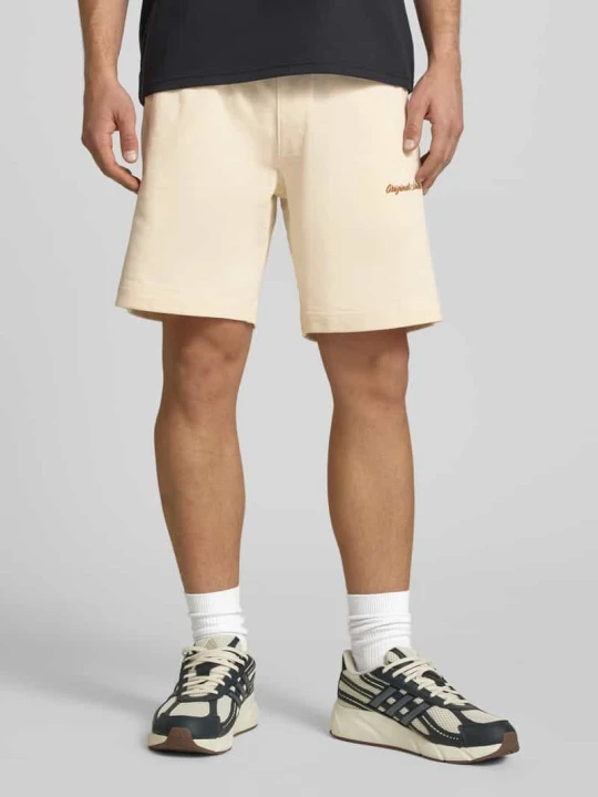 Zdjęcie produktu Szorty dresowe z wyhaftowanym logo model „KARL” Jack&Jones Złamany biały