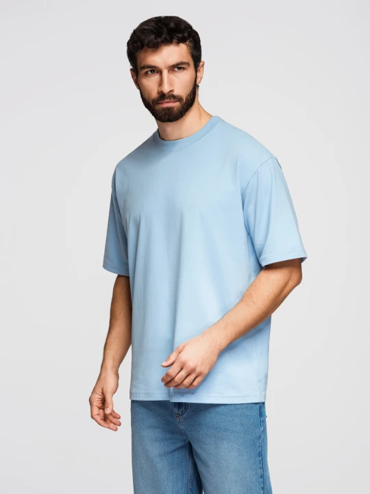 Zdjęcie produktu T-shirt bawełniany męski LOOSE FIT z okrągłym dekoltem – błękitny V7 - Rozmiar: M Ombre Clothing
