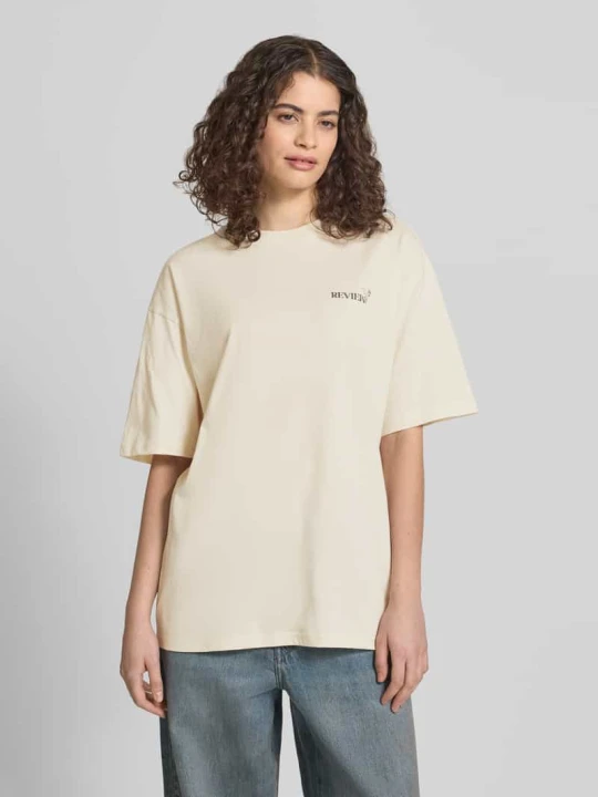 Zdjęcie produktu T-shirt o kroju oversize z nadrukiem kwiatów na plecach REVIEW Złamany biały