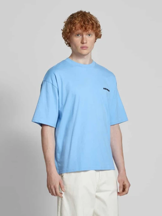 Zdjęcie produktu T-shirt o kroju oversized z nadrukiem z logo REVIEW Jasnoniebieski