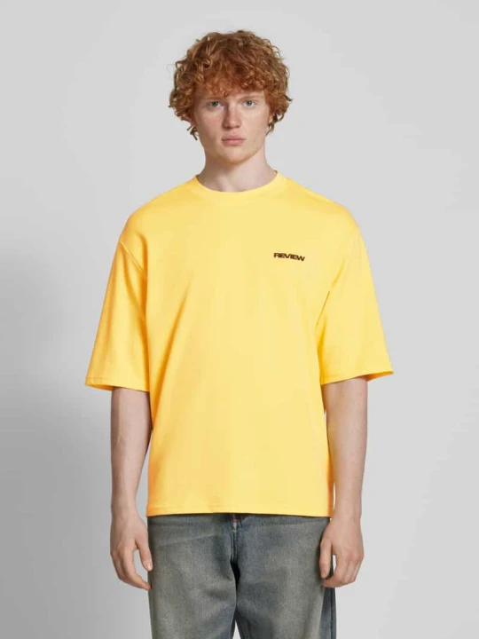 Zdjęcie produktu T-shirt o kroju oversized z nadrukiem z logo REVIEW Pastelowy żółty