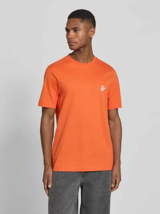 Zdjęcie produktu t-shirt o kroju regular fit z czystej bawełny Tommy Hilfiger Pomarańczowy