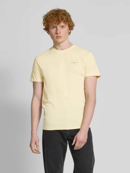 Zdjęcie produktu T-shirt o kroju regular fit z czystej bawełny z nadrukiem z logo Tommy Jeans Jasnożółty