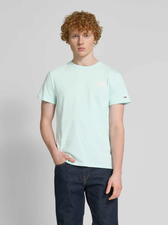 Zdjęcie produktu T-shirt o kroju regular fit z czystej bawełny z napisem z logo Tommy Jeans Turkusowy