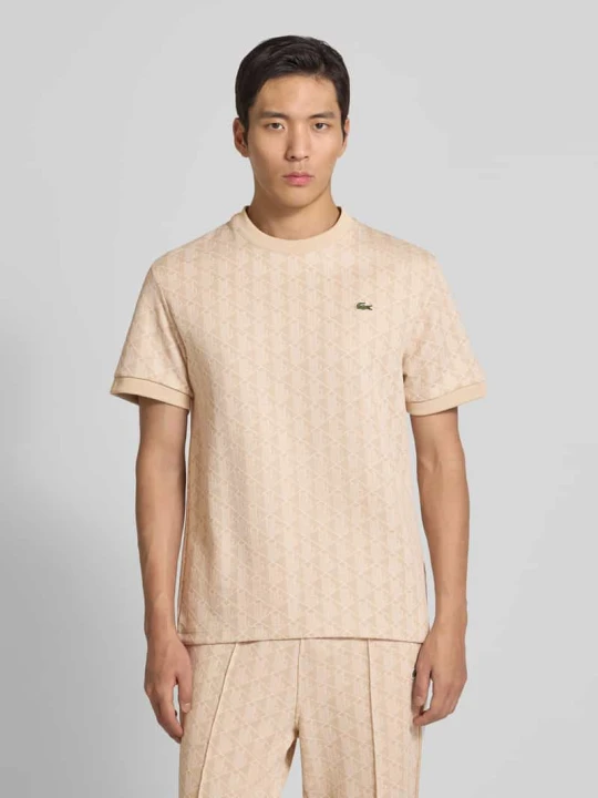Zdjęcie produktu T-shirt o kroju regular fit z dodatkiem bawełny Lacoste Złamany biały