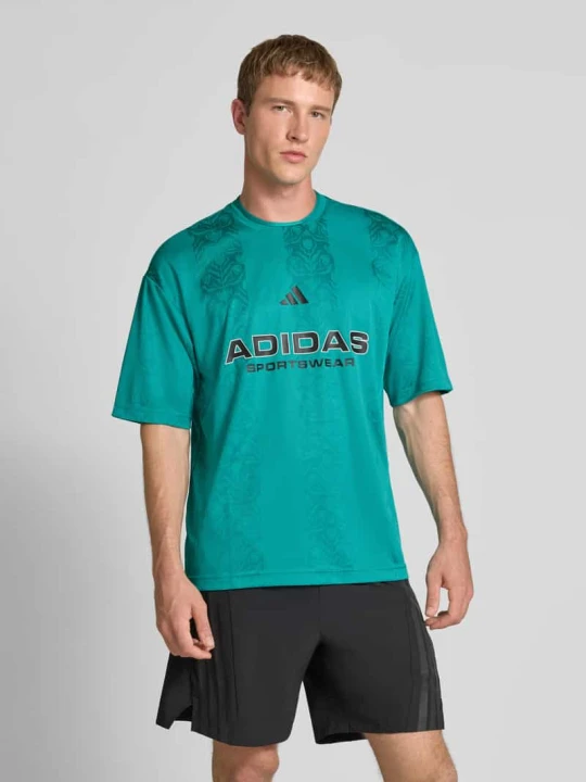 Zdjęcie produktu T-shirt o kroju regular fit z nadrukiem z logo model ‘Tiro’ Adidas Limonkowy