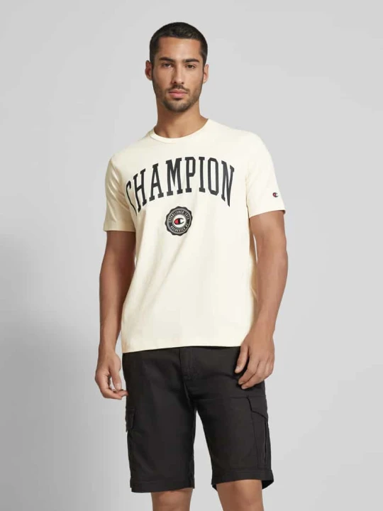 Zdjęcie produktu T-shirt z nadrukiem z logo model 'Bookstore' Champion Złamany biały