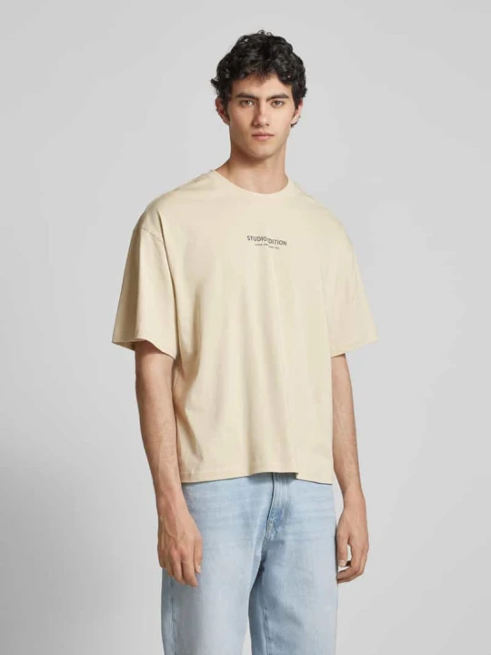 Zdjęcie produktu T-shirt z nadrukiem z logo model ‘Studio Edition’ Alpha Industries Złamany biały