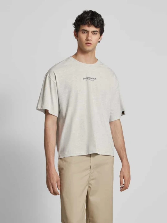 Zdjęcie produktu T-shirt z nadrukiem z logo model ‘Studio Edition’ Alpha Industries Jasnoszary melanż