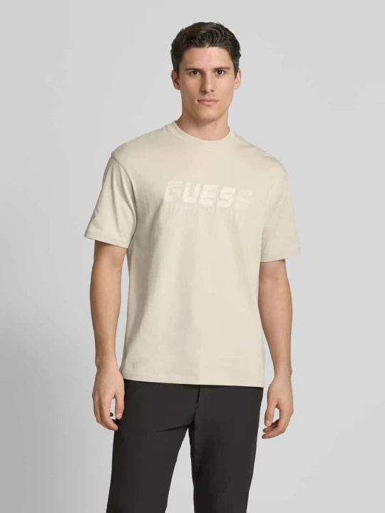Zdjęcie produktu T-shirt z nadrukiem z logo model ‘SURON’ Guess Beżowy