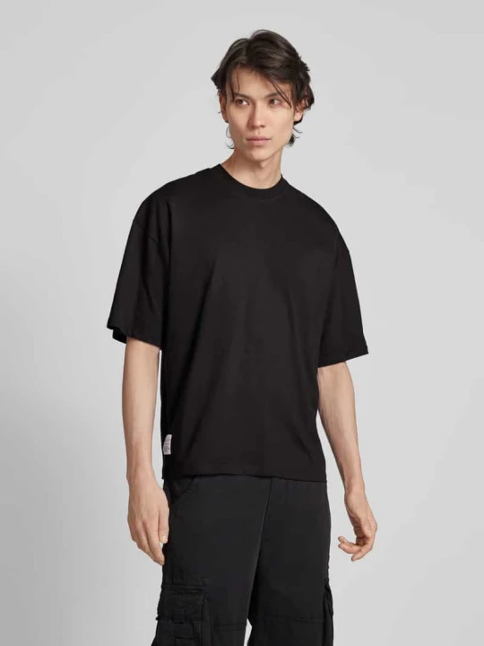 Zdjęcie produktu T-shirt z naszywką z logo model ‘LOGO’ Alpha Industries Czarny