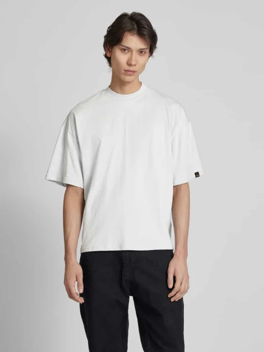 Zdjęcie produktu T-shirt z naszywką z logo model ‘LOGO’ Alpha Industries Jasnoszary