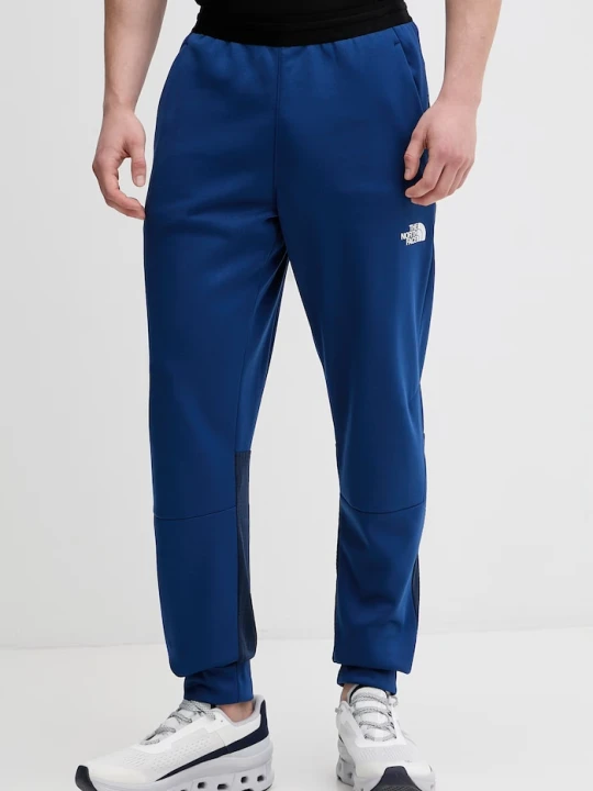 Zdjęcie produktu The North Face spodnie dresowe męskie MOUNTAIN ATHLETICS FLEECE granatowy