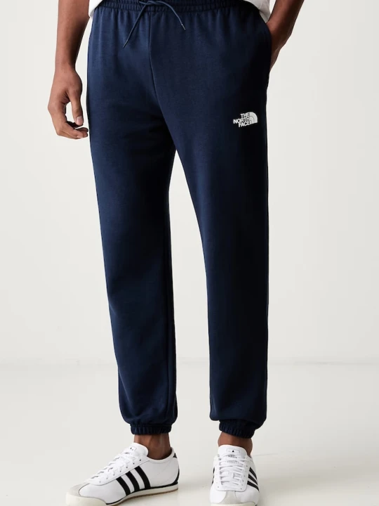 Zdjęcie produktu The North Face spodnie dresowe męskie z bawełną Simple Dome granatowy