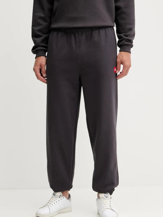 Zdjęcie produktu The North Face spodnie dresowe Redbox szary