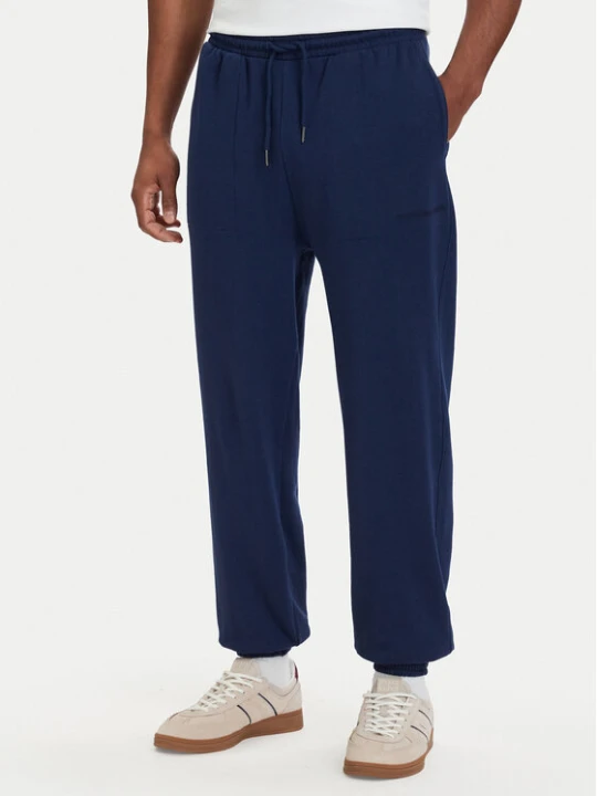 Zdjęcie produktu Tommy Hilfiger Spodnie dresowe Essential UM0UM03911 Granatowy Relaxed Fit