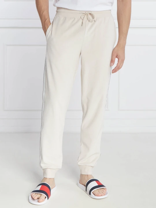 Zdjęcie produktu Tommy Hilfiger Spodnie dresowe | Regular Fit kremowy