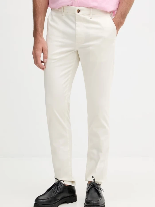 Zdjęcie produktu Tommy Hilfiger spodnie slim fit męskie z bawełną beżowy