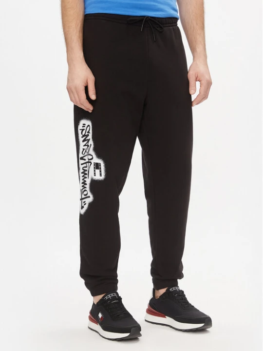 Zdjęcie produktu Tommy Jeans Spodnie dresowe Tjm Reg Tommy Spray Sweatpant DM0DM18376 Czarny Regular Fit