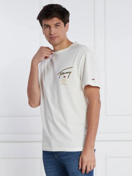 Zdjęcie produktu Tommy Jeans T-shirt GOLD SIGNATURE BACK | Regular Fit kremowy