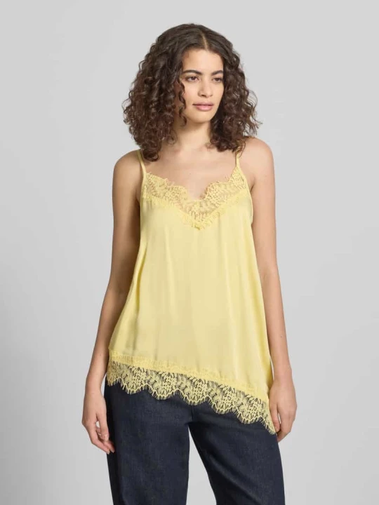 Zdjęcie produktu Top o kroju relaxed fit z koronkowym wykończeniem model 'Tami' Oh April Pastelowy żółty