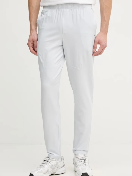 Zdjęcie produktu Under Armour spodnie joggery męskie Unstoppable szary