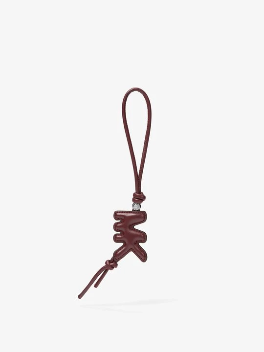 Zdjęcie produktu Wypukła zawieszka do torebki ze skóry z logo Michael Kors OXBLOOD (Czerwony)