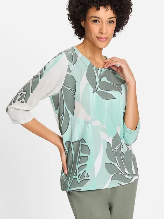 Zdjęcie produktu Zielona bluza damska Henny z roślinnym wzorem – Urban Jungle Olsen