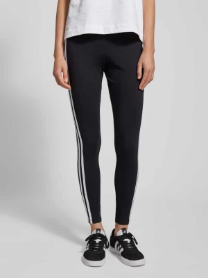 Legginsy o kroju skinny fit z paskami w kontrastowym kolorze adidas Originals