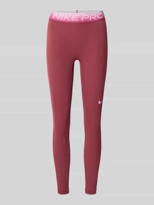 legginsy sportowe o kroju slim fit z nadrukiem z logo Nike Bordowy