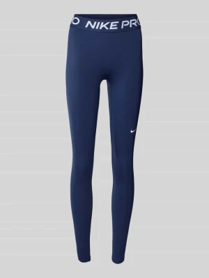 Legginsy typu slim fit z nadrukiem logo Nike Training