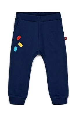 Lego spodnie dresowe bawełniane dziecięce kolor granatowy z nadrukiem