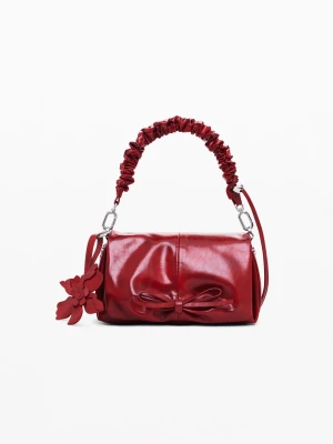 Mała błyszcząca torebka z kokardą Desigual