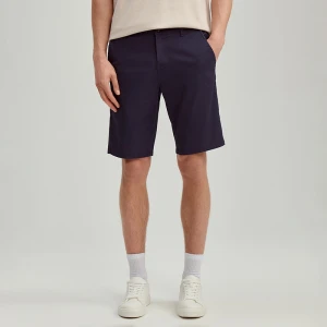 Materiałowe szorty z odwiniętymi nogawkami przed kolano niebieskie House