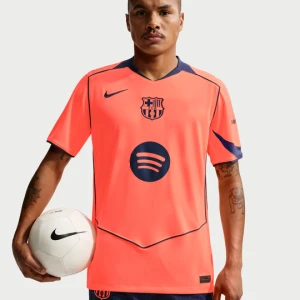 Męska koszulka piłkarska Nike Dri-FIT Total 90 FC Barcelona 2025 / 26 Stadium (wersja trzecia) – replika - Pomarańczowy