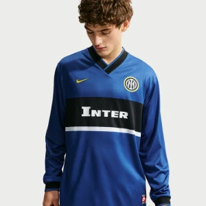 Męska koszulka piłkarska z długim rękawem Nike Dri-FIT Inter Milan Energy (wersja wyjazdowa) - Niebieski